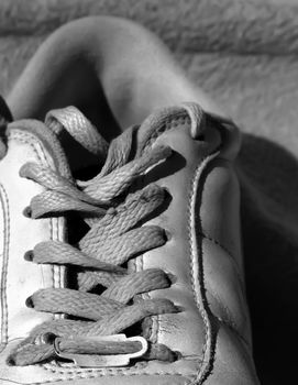 Detail shot of old worn out sneakers, depicting the sneaker culture