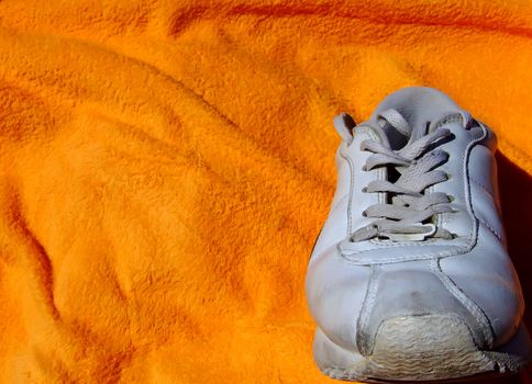 Detail shot of old worn out sneakers, depicting the sneaker culture