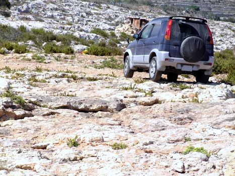 Small offraod vehicle on hard and tough Mediterranean trek