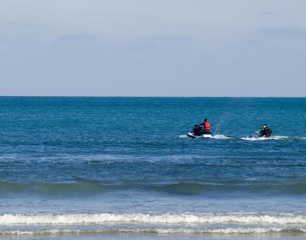 Jetski sport drivers having fun off the coast in Malta.