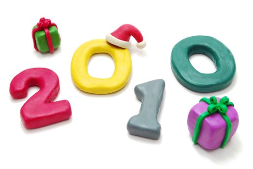 3D New Year Text 2010 Laying Random with Gifts Made of Colored Plasticine Isolated on White Background