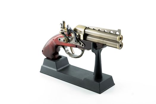 Desktop model of an ancient pistol on white background. Isolated object.