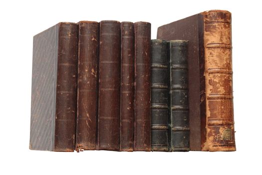 Few ancient books standing in a row isolated on white background with clipping path