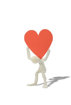 Plasticine man with big red heart on his shoulders. Isolated on white with clipping path