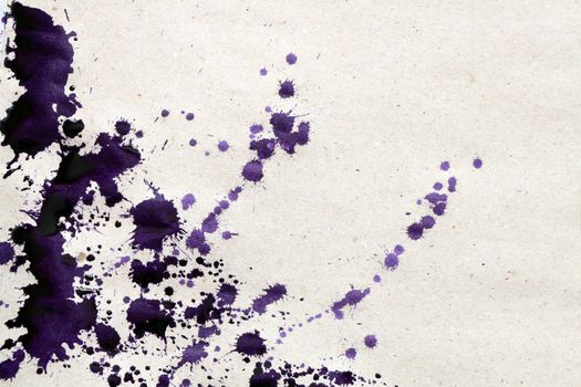Background made from rough paper with violet ink blot