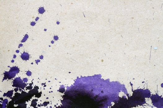 Background made from rough paper with violet ink blots