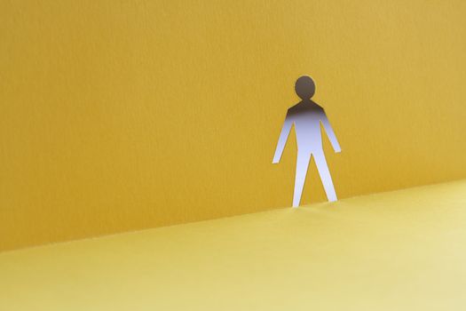 Abstrack background with man figure cutting from yellow paper