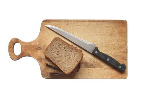 Sliced rye bread and kitchen knife on breadboard. Isolated with clipping path
