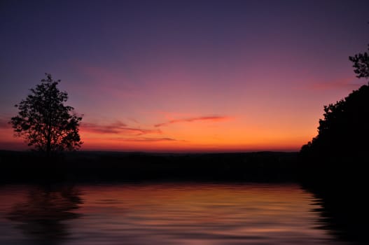 Beautiful summer sunset reflecting in a lake. 