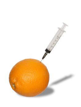 Orange with syringe isolated on white with clipping path