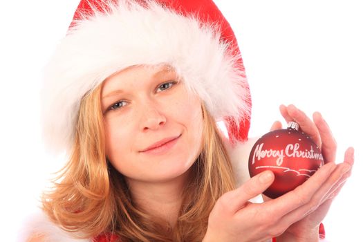 Miss Santa is holding a red christmas tree ball - "Merry Christmas" is written on the ball