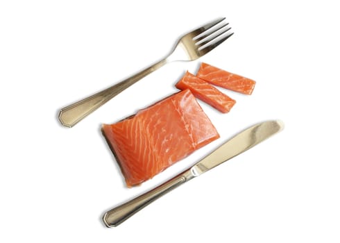 Fork and knife near fresh salmon steak isolated on white background with clipping path