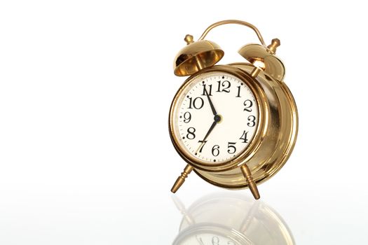 Golden alarm clock isolated on white background with clipping path