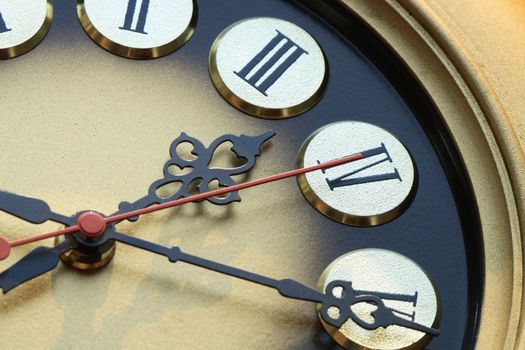 Extreme closeup of nice golden vintage clock dial