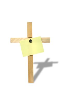 Blank yellow paper tablet hanging on wooden cross. Isolated on white with clipping path