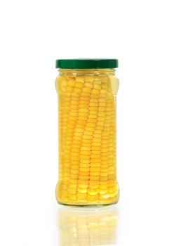 Corn inside glass jar isolated on white background with clipping path