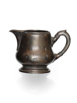 Ancient bronze milk jug isolated on white background with clipping path