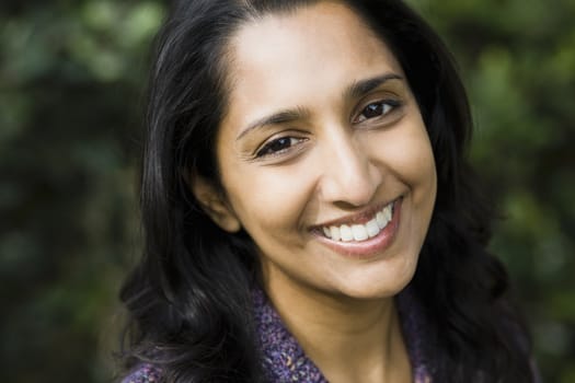 Portrait of a Smiling Indian Woman Outdoors