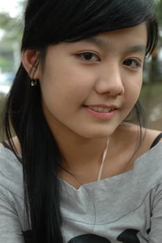 young asian lady with nice smile expression