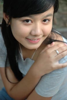 young asian lady with nice smile expression