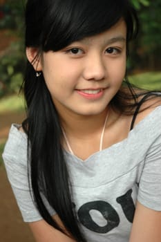 young asian lady with nice smile expression