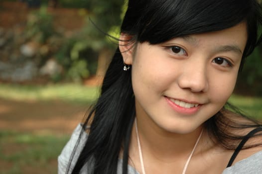 young asian lady with nice smile expression