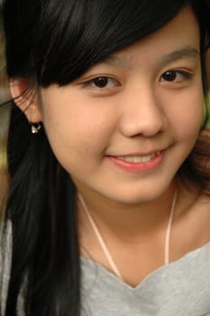 young asian lady with nice smile expression