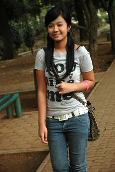 young asian lady get walking in the park