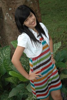 young asian lady stand up in the park