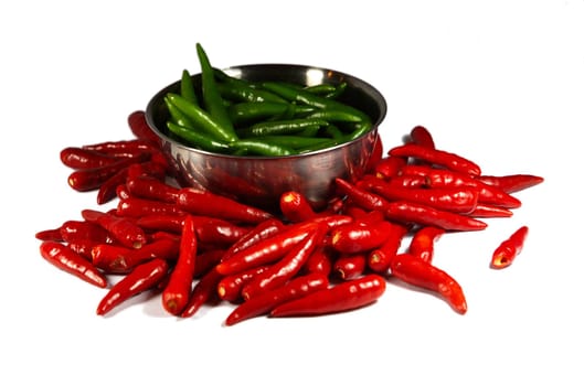 Red and Green Spicy chili pepper in the plate. Isolated on white