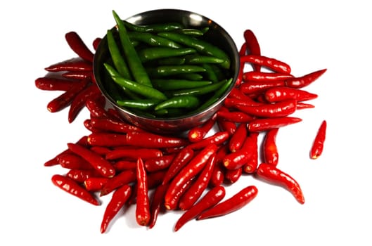 Red and Green Spicy chili pepper in the plate. Isolated on white