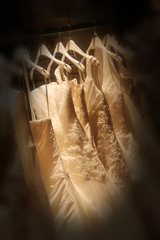 the dress of the bride on a hanger