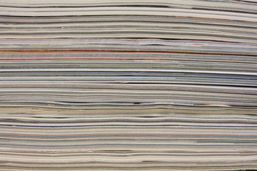 stack of colorful magazines or documents - paper edges background