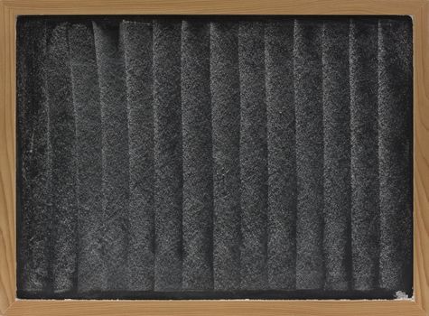 texture of white chalk vertical smudges on blackboard in wooden frame