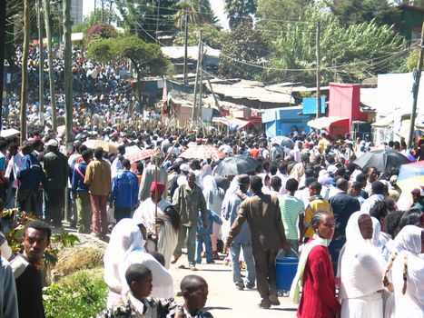 A large crowd singing and chanting while accompanying the Tabot (model of the arc of covenant) of St Michael church during Timket (baptism in Amharic) celebrations - The baptism of Jesus (Taken on January 21, 2008)