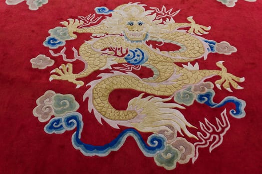 Dragon image on the carpet in chinese temple, Thailand.