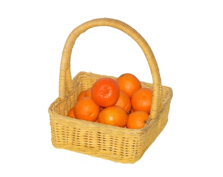 Nice yellow wicker basket with tangerines isolated on white with clipping path