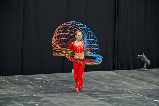 A young chinese girl performing at the Chinese Acrobat show