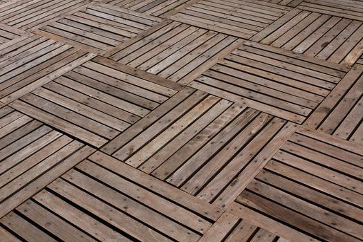 Patterns and textures of a wooden planks pavement