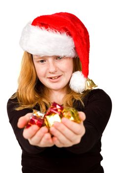 little girl is holding little christmas presents isolated on white