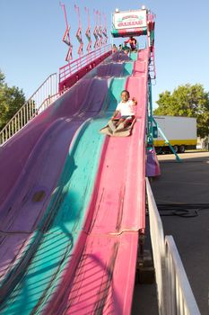 Kids sliding down on the big slide at the 2011 Queen City Ex