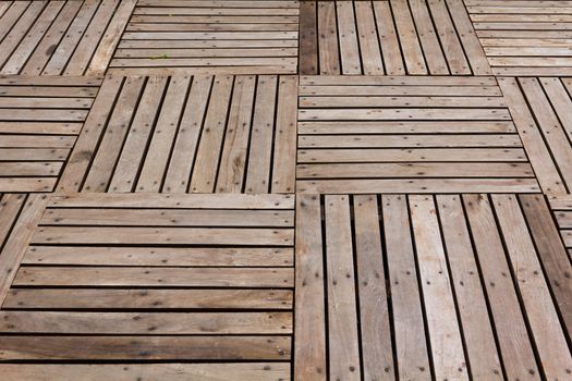 Patterns and textures of a wooden planks pavement