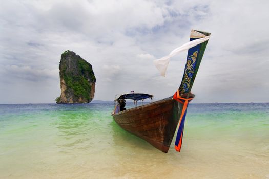 Longtailboat tied up at the beach in Thailand 