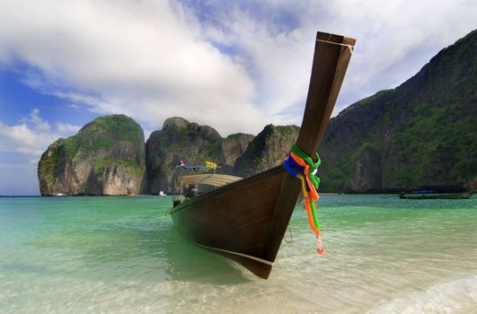 Longtailboat tied up at the beach in Thailand 