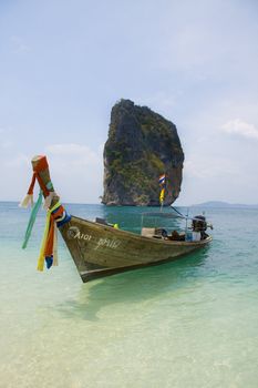 Longtailboat tied up at the beach in Thailand 