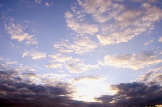 Sunny morning sky full of beautiful clouds.