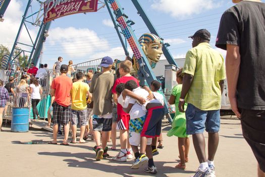 People lined up to get on the many rides at the 2011 Queen City Ex