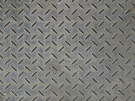 Diamond steel plate useful as a background