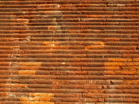 Ancient roman brick wall useful as a background