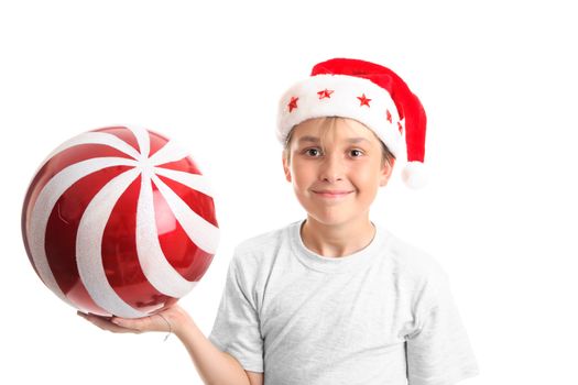Boy holding a large red Christmas bauble with glitter swirls